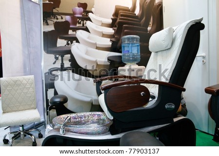 MOSCOW - APRIL 14: Massage office chair at the international exhibition of professional cosmetics and beauty salon equipment INTERCHARM on April 14, 2011 in Moscow, Russia