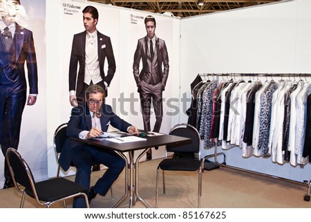 MOSCOW - SEPTEMBER 7: Man presents a collection of clothes at the international exhibition of  the fashion industry, Collection Premiere Moscow, CPM on September 7, 2011 in Moscow