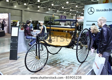 MOSCOW - SEPTEMBER 16: People are interested Benz Patent Motorwagen (motorcar) 1886 at the international exhibition of the technical antiques on September 16, 2011 in Moscow, Russia