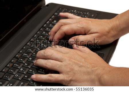 hand typing on a laptop isolated on white