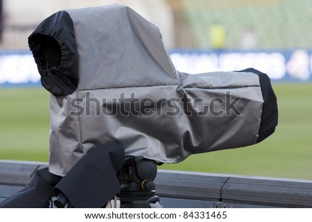 Camera with rain cover at a football match