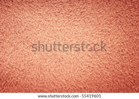 pink background of soft fluffy material texture with effect of dark vignette