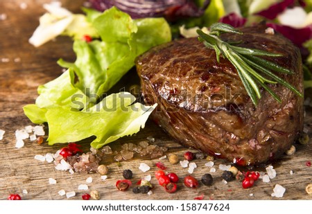 Grilled steak on wood