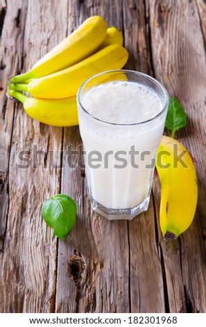 Fresh milk, banana drink on wodeen table, assorted protein cocktail with fresh fruits.