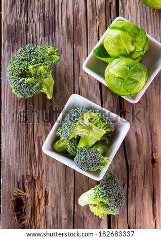 Brussels sprout and broccoli on wooden table. Fresh vegetable on wooden background. Organic vegetable.