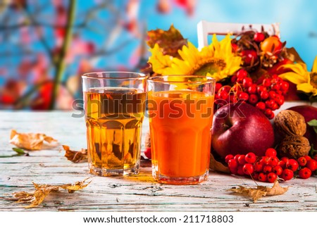 Fresh juice, autumn concept with seasons vegetable on wooden table