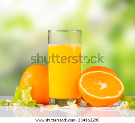 Fresh juice, mix fruits, orange drink with nature green background