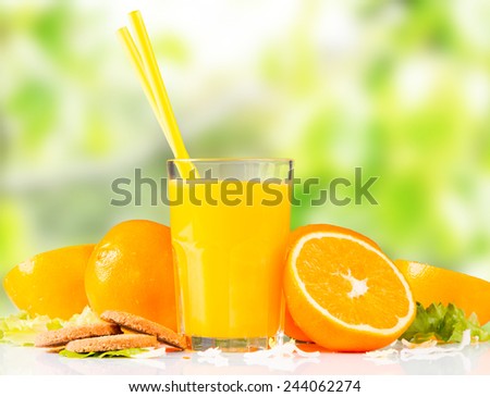 Fresh orange juice, mix fruits, orange drink with nature green background