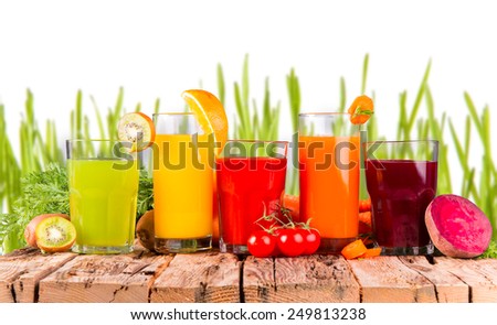 Fresh juice, mix fruits and vegetable  with  fresh green grass isolated on white background