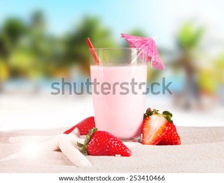 Fresh milk, strawberry drink on wooden table, assorted protein cocktails with fresh fruits and tropical beach background.