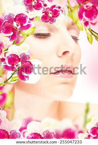 Spa woman with orchid. Hairstyle. Beautiful flowers orchid on woman head