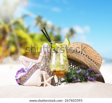 Mojito drink,Straw Hat  with tropical beach background