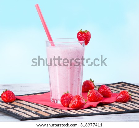 Fresh milk, strawberry drink on wooden table, assorted protein cocktail with fresh fruits.