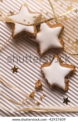 star shaped glazed cookies and decorative gold ribbon