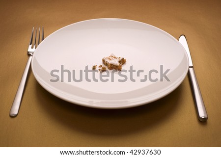 glazed nut cake on dish, on gold background