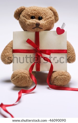 stock photo : valentines day teddy bear holding envelope with decorative red 