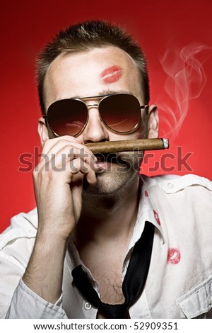 young handsome man with cigar and lips imprints