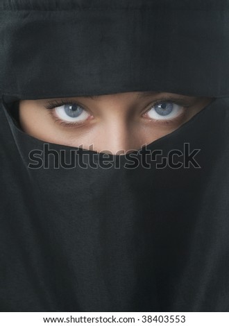 Beautiful blue eyed woman in traditional Niqab veil