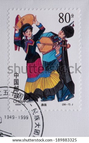 CHINA - CIRCA 1999:A stamp printed in China shows image of China 1999 -11 50th Ann Founding PRC 56 Ethnic Costumes, 56 ethnic dance music,circa 1999