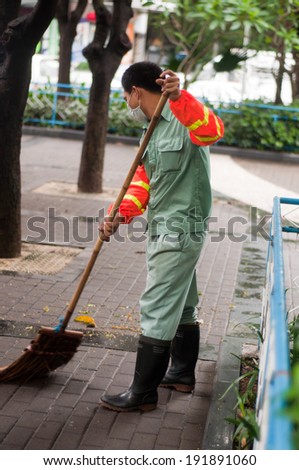 Zhuhai, China - May 10, a Clean the sanitation workers cleaning the streets in the morning at Xiangzhou Zhuhai China May 10, 2014