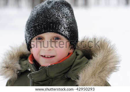 Winter games children - portrait of a boy in winter clothes, isolated