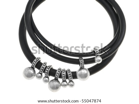 Bracelet made of black plastic rings with metal studs, isolated