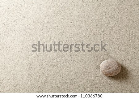 Beige stone at right side of sand background