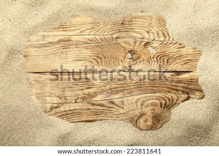 Sand frame on planked wood. Summer concept with copy space. Top view