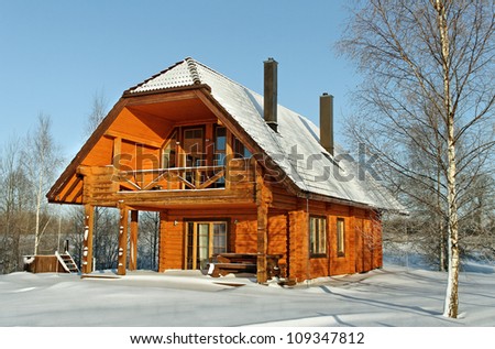 House in winter season and wooden bath barrel.