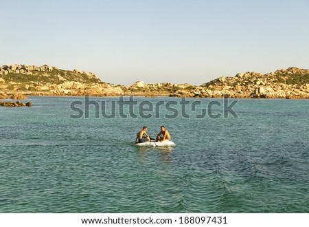 SEPTEMBER 2014 - Tour of the Italian  islands. Two men on motor boat in the Mediterranean Sea on September 22, 2014.