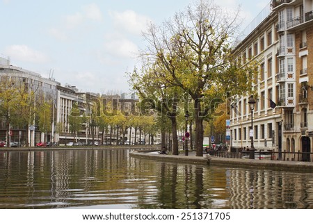 PARIS - NOVEMBER 27: The Canal Saint-Martin is a 4.5 km long canal in Paris. View to the canal and city life in an autumn time on November 2014, Paris.