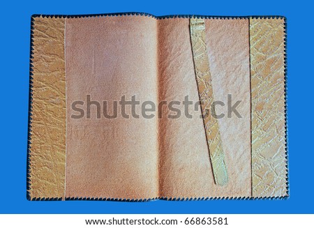 Opened leather book`s and document`s cover with strip on the blue surface.