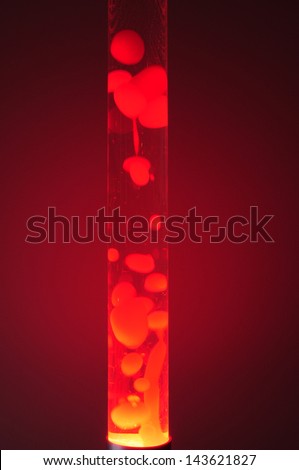 Red lava lamp at night. Studio shot, isolated in darkness