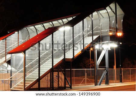 Pedestrian walkway on Train Station at Night. Black and White photo.