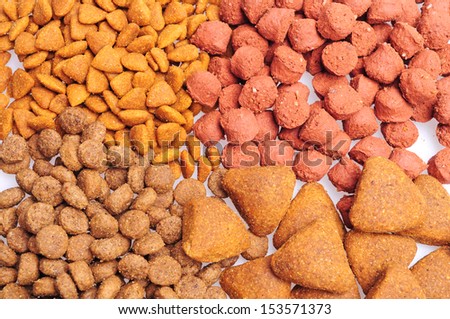 Assorted Dry dog food close up, isolated on white background