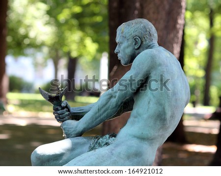 BELGRADE, SERBIA, CIRCA 2012 - The fountain with man sculpture in central garden circa 2012 in Belgrade, Serbia