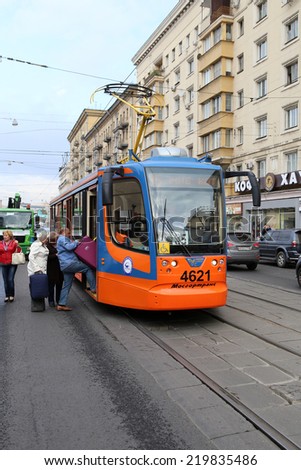 MOSCOW, RUSSIA, CIRCA 2014 - Passenger come into tramway of new model circa 2014 in Moscow, Russia