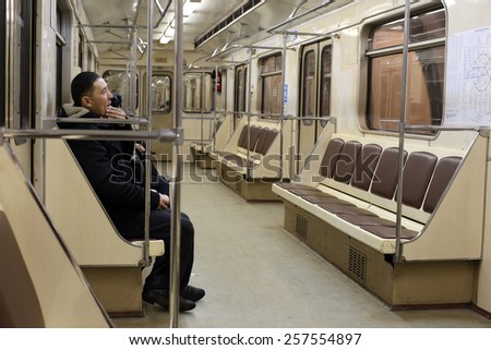 MOSCOW, RUSSIA, CIRCA 2015 - Passengers sit in the car of underground train circa 2015 in Moscow, Russia
