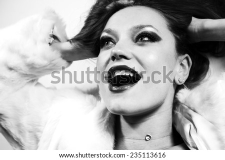 studio photo, laughing girl in black and white