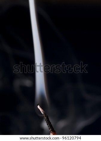Smoke rises from an extinguished  Candle Flame
