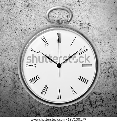 Antique golden pocket watch on grunge background, monochrome. Concept of time, past or deadline
