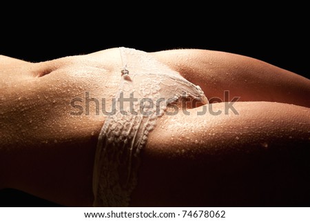 stock photo Wet body of a sexy young woman in beautiful white panties 