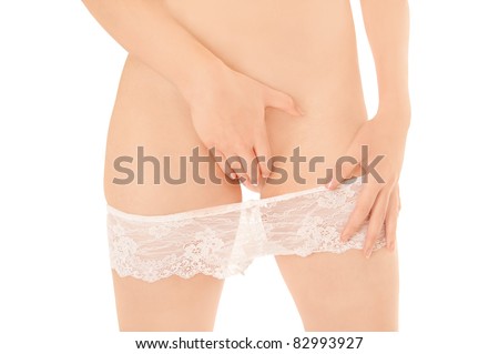 stock photo Beautiful slim woman taking off her white panties