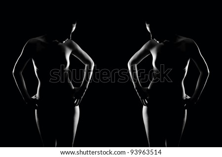 Erotic contour of two beautiful nude women, high contrast photo in front of black background, monochrome