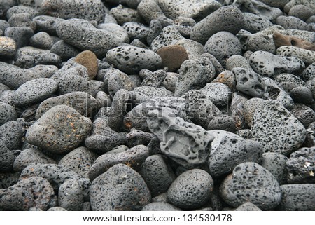 Sulfur Volcanic Activity at Galapagos, lava stones black background