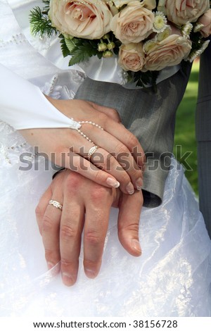 Hands of a young married couple