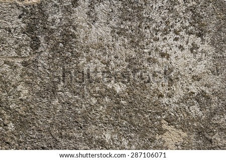 Chaotic fine grained texture of old gray sandy concrete