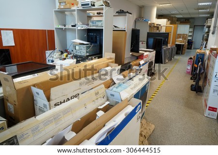 VILNIUS, LITHUANIA - AUGUST 14, 2015: Working room of Lithuanian service   repair of TVs and consumer electronics. Repair all known brands is provided - Panasonic, Sharp, Philips, Samsung and so on.