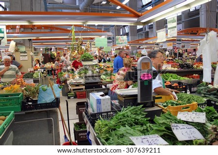 MILAN, ITALY - JUNE 24, 2015: Indoor city market of  Italian vegetables and fruits. Italy - the largest producer in Europe a citrus - over 3,3 million tons per year, and tomatoes - 5,5 million tons.