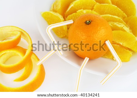 The small orange similar to the little man, sits on the brink of a plateau. At his feet an orange peel. On a plateau - orange slices.